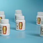 Bottles_of_Lingzhi_Plus_capsules_on_blue_background