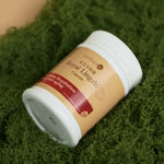 Front view of Royal Lingzhi capsule bottle for immune regulation on green moss