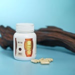 Lingzhi_Plus_bottle_and_capsules_by_wood