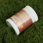 Schisandra_Tablet_bottle_lying_on_green_textured_fabric_surface